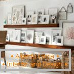 Arrangement of photos on wooden shelves