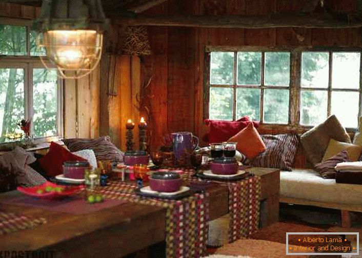 A lot of pillows, colorful tablecloths on the tables will help create a cozy place in the country's living room.