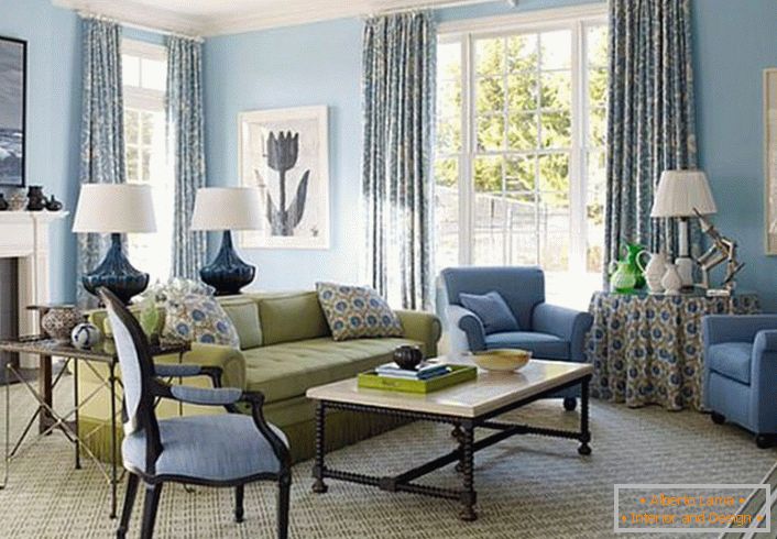 An interesting print on pillows, curtains and tablecloths define the style of French country. The room is decorated in a delicate cream and blue color.