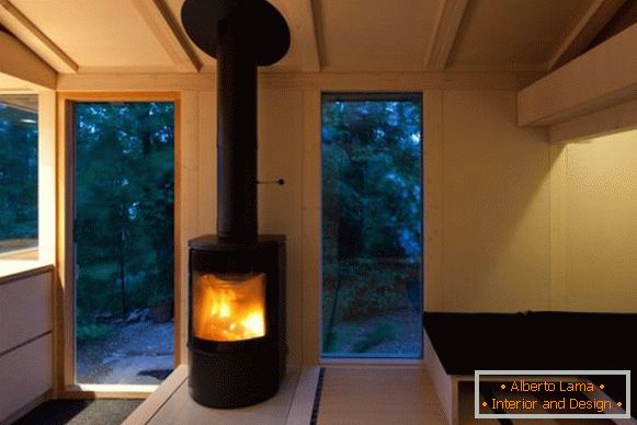 Fireplace in the interior of a small cottage in Finland