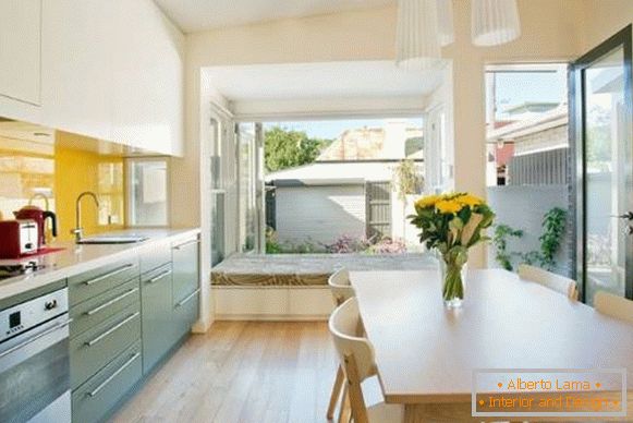 Modern minimalist kitchen design with a bay window