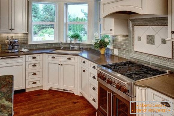 Kitchen design with a bay window and a sink under it