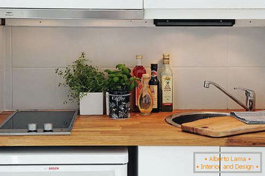 White kitchen set with wooden top