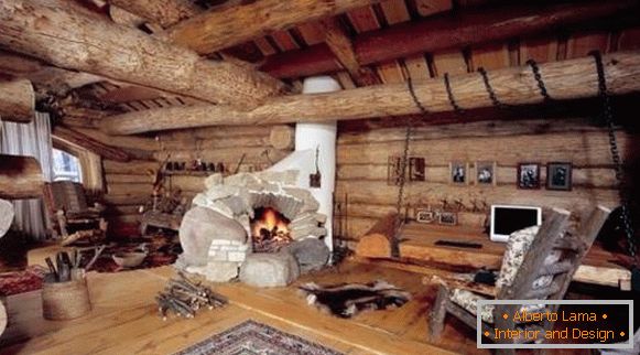 Wooden house inside in country style with a fireplace stove