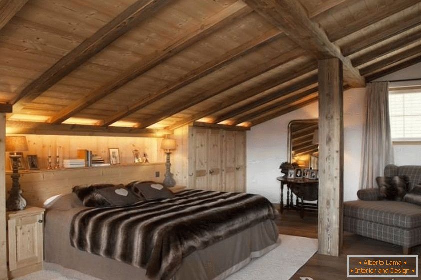 Bedroom with mansard wooden ceiling