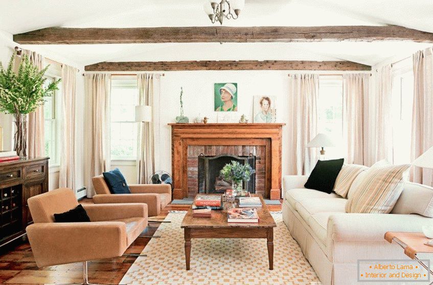Living room with exposed beams on the ceiling and a fireplace