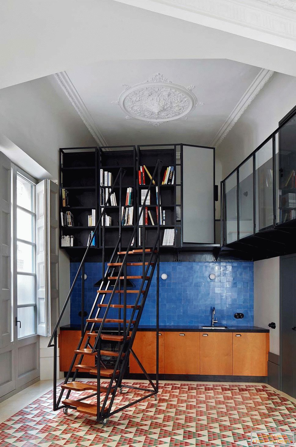 Bookcase in the interior of a small two-level apartment