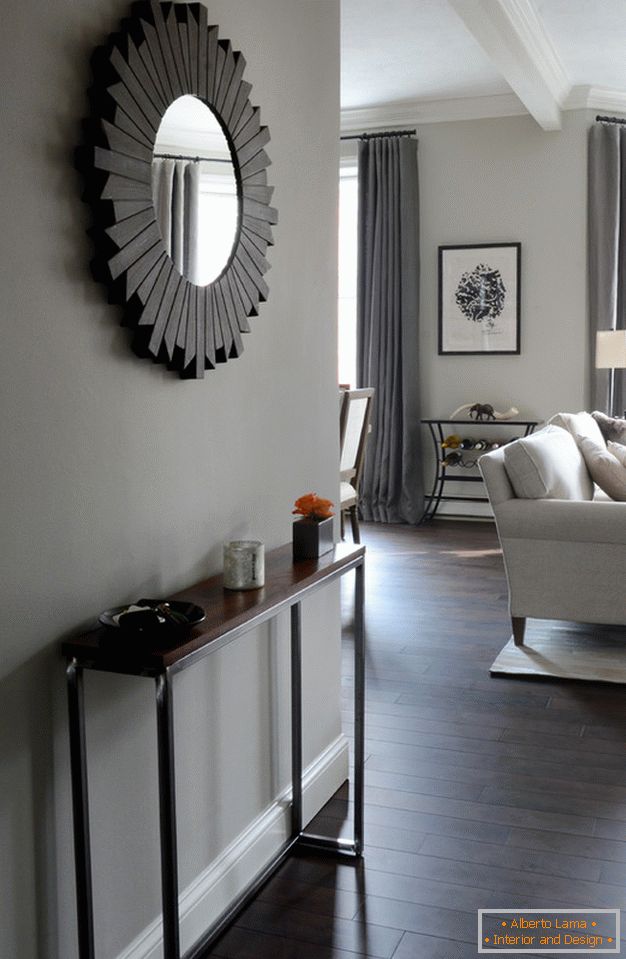 Interior of a small apartment: a round mirror in the hallway