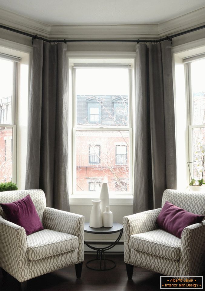 Interior of a small apartment: sitting area at the window