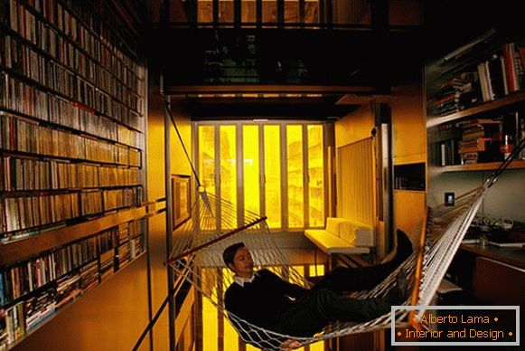Interior of a small room: a hammock in the library