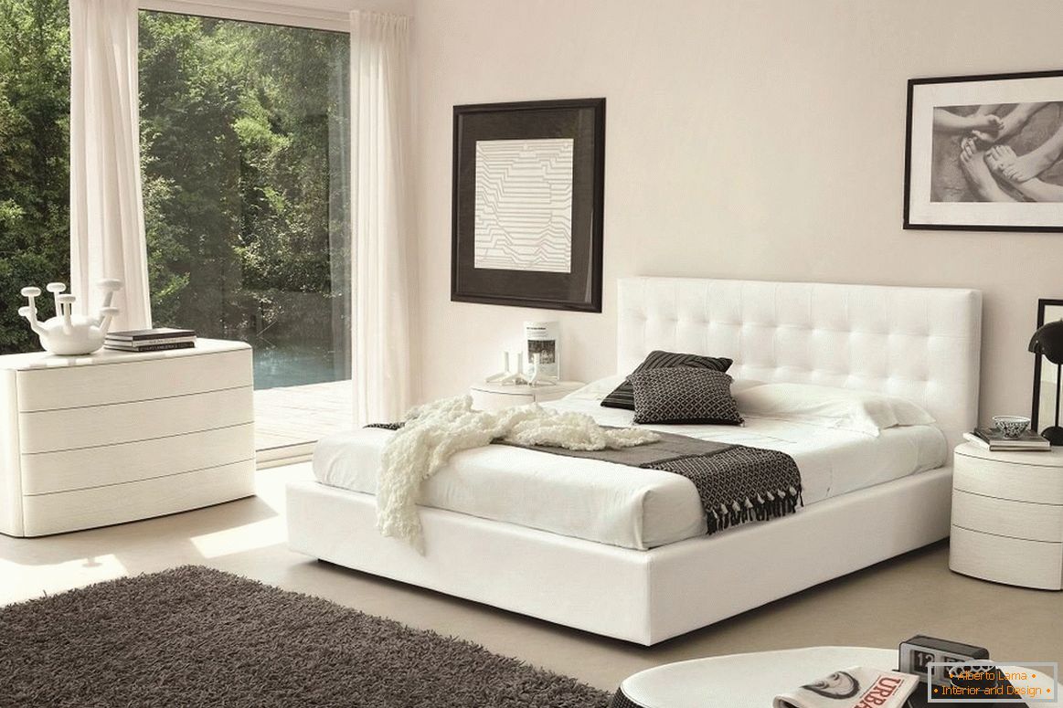 White bed, chest of drawers and bedside table in the bedroom