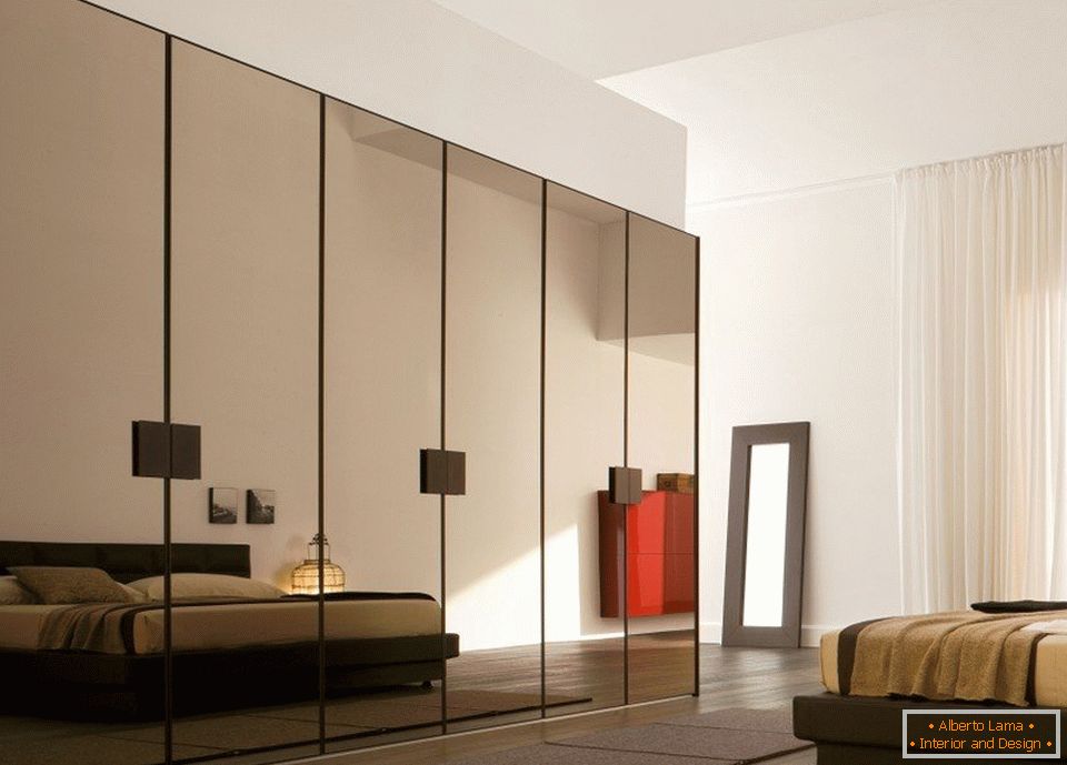 Mirror-coated wardrobe by the bed