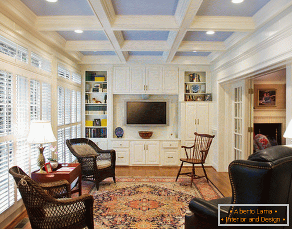 Interior of a small living room with an accent on the ceiling