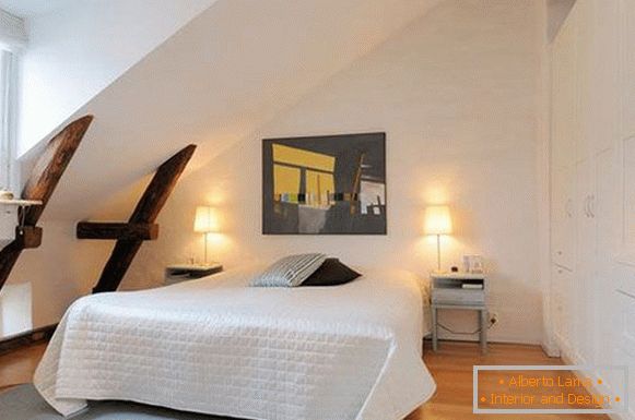 Wooden beams in the interior of a white bedroom