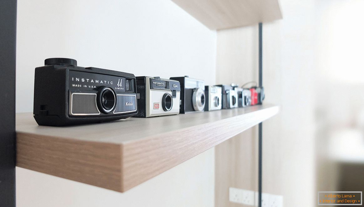 A collection of cameras on the shelf