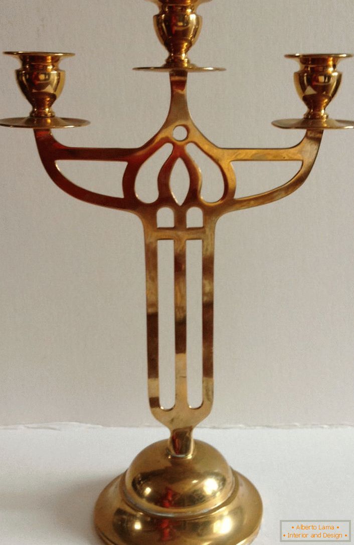 The unusual design of a candelabrum made of copper.
