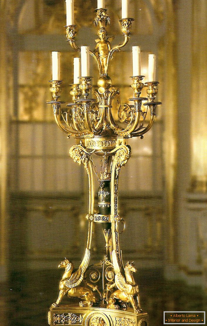 A noble, refined golden candelabra for nine candles will decorate the interior of any country house or hunting lodge.