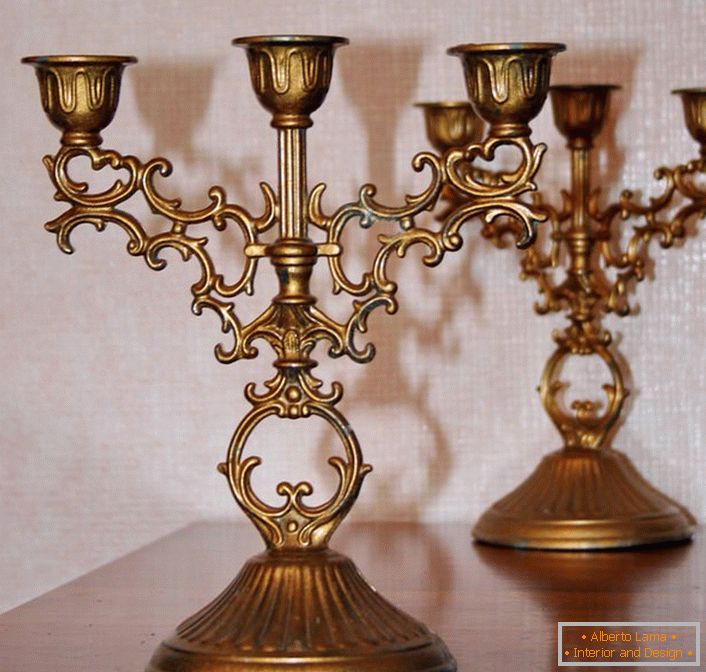 The classic copper candelabra for three candles is not just an assistant in cases of a malfunction of the electrical network, it is also a stylish detail of any interior.