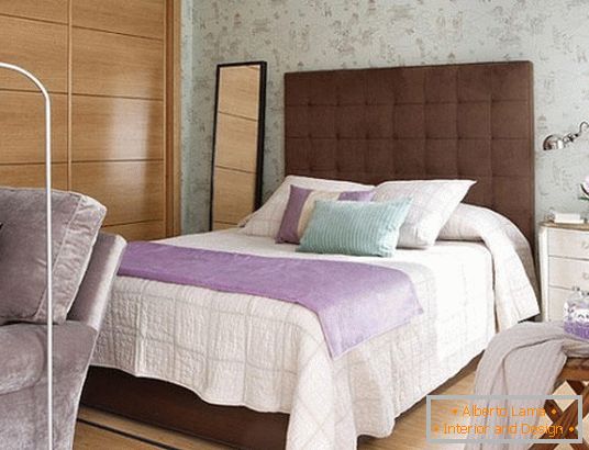 Bed with a high headboard in the bedroom