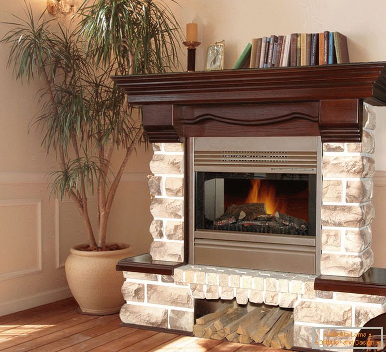 Noble fireplace made of bricks with decorative elements of dark wood in a Moscow country house.