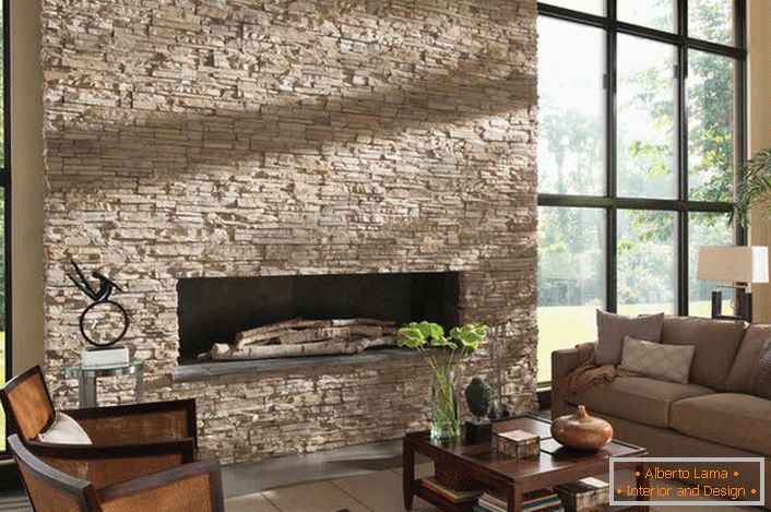 Respectability to a spacious hall gives the decoration of the fireplace with a decorative Caucasian stone. 