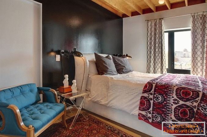 Eclectic bedroom with black wall