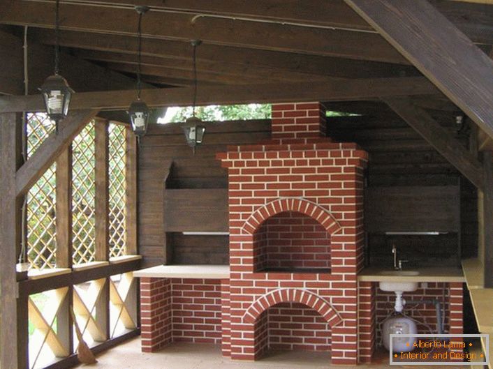 Functional decoration of the arbor in the style of the chalet was a stove-fireplace. 