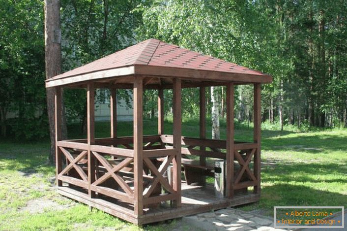 An open gazebo in the style of a chalet has an uncomplicated design that can be assembled by one's own hands.
