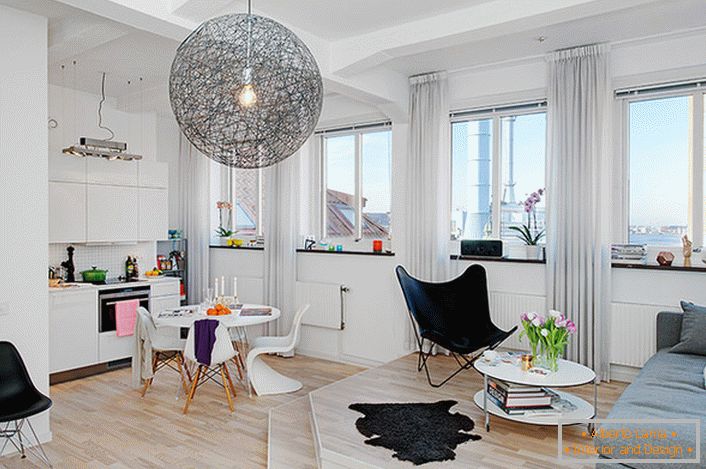 Studio apartment measuring 40 square meters. It is decorated in Scandinavian style. 