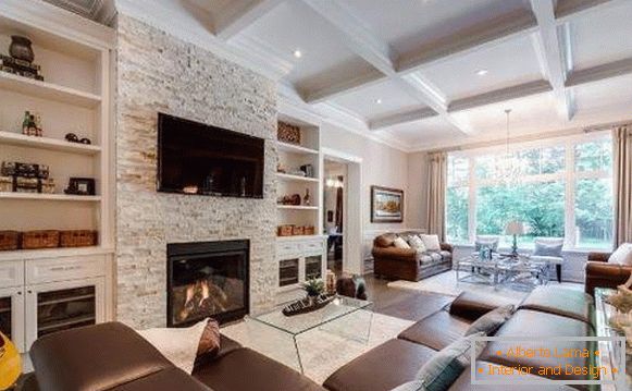 How to decorate the hall in your house - the interior of the living room with a fireplace