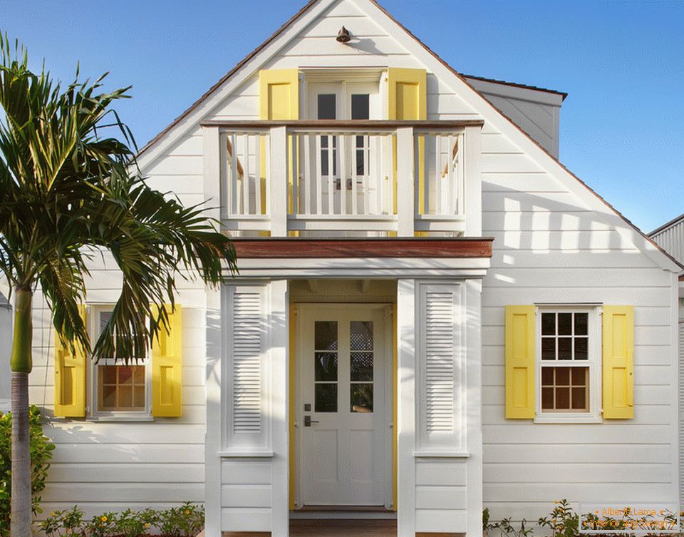 A small beach house of white color