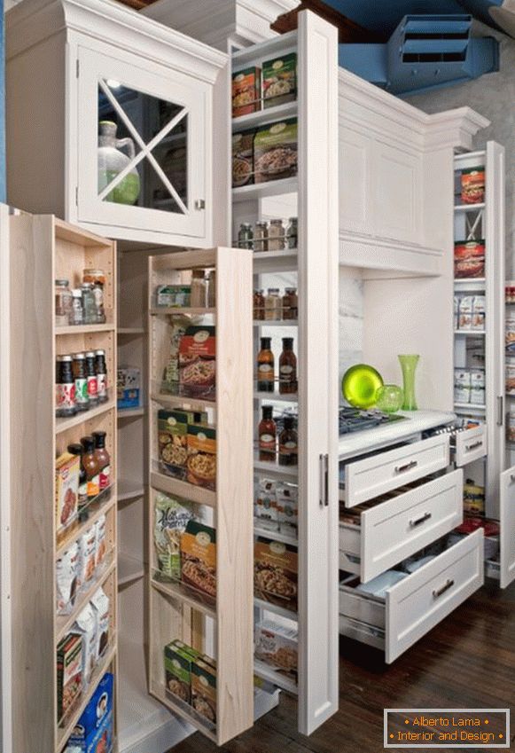 Cabinets and shelves with products in the interior of a small kitchen