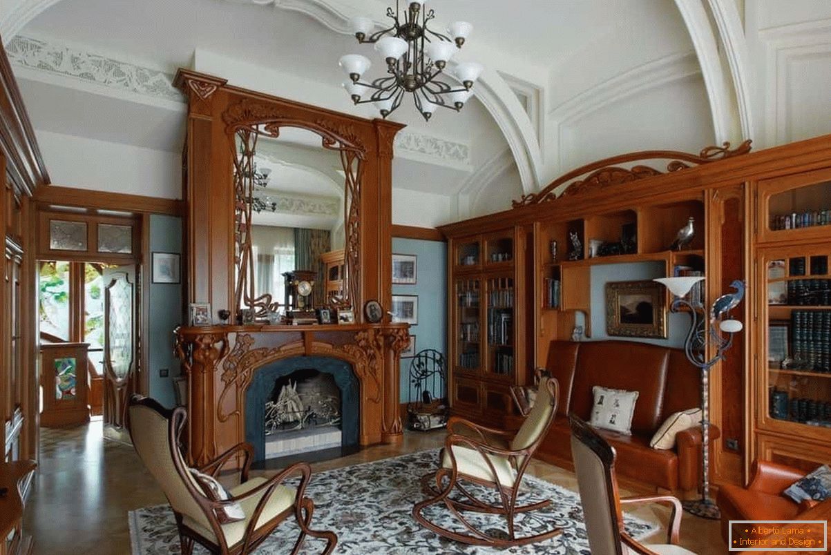A lounge with bookcases and an art-nouveau fireplace