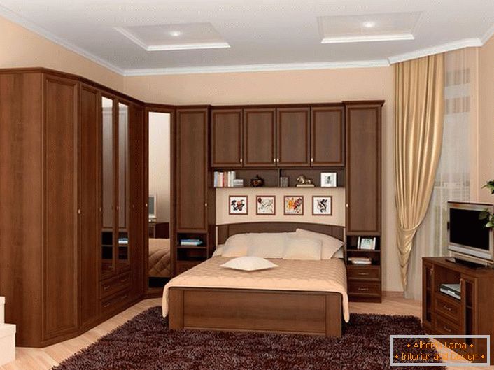 A practical solution for bedroom arrangement is a modular suite that runs on the bed. Effective space saving.