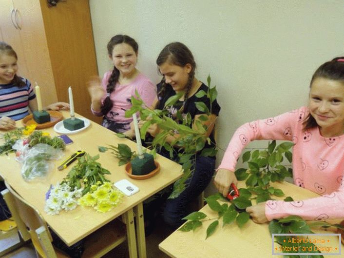 We learn how to decorate candlesticks with flowers and leaves.