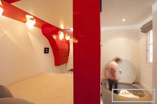 The original design of the bedroom: a transformable red and white room and a bathroom