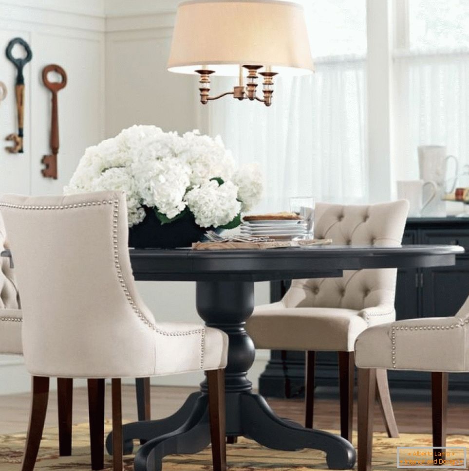 Beige chandelier above the gray table