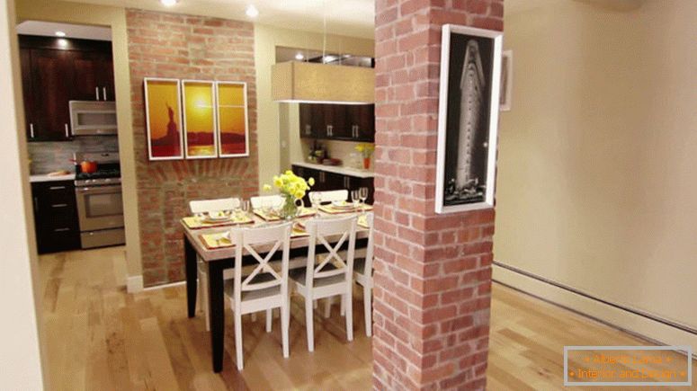 A tiny brick kitchen that has been renovated.