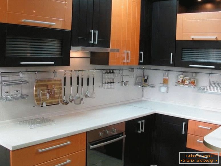 Combination of orange with Wenge color in a corner kitchen