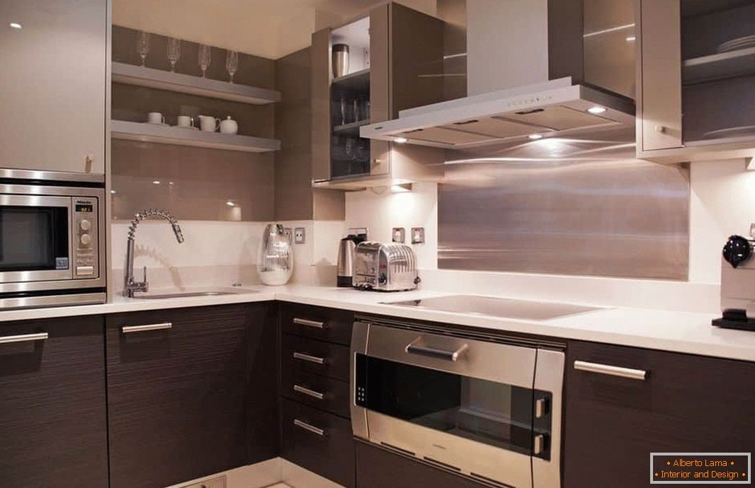 The combination of metallic shades and wenge in a square kitchen