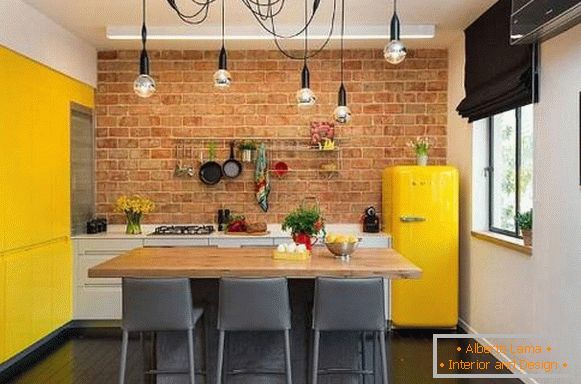 Kitchens in loft style with a brick - photo with bright decor