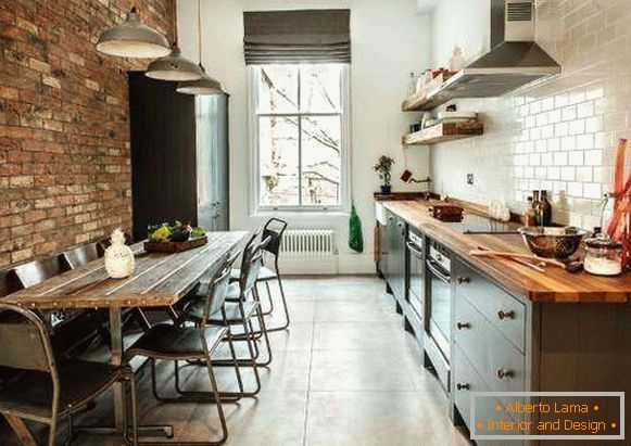 Loft style - kitchen with brick wall and white tiles