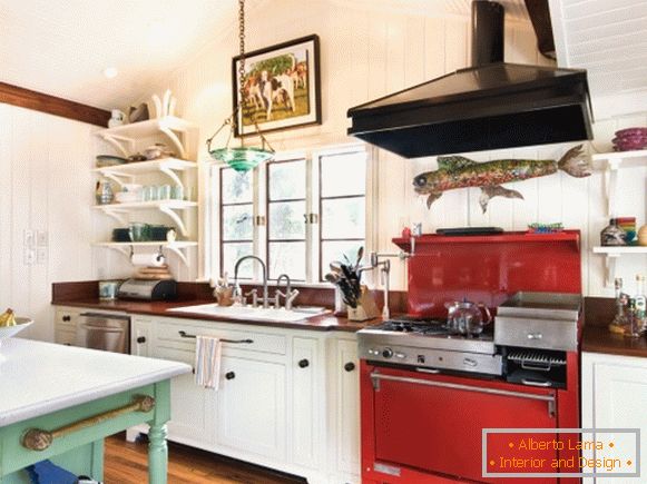 Red stove in the kitchen in the style of Provence