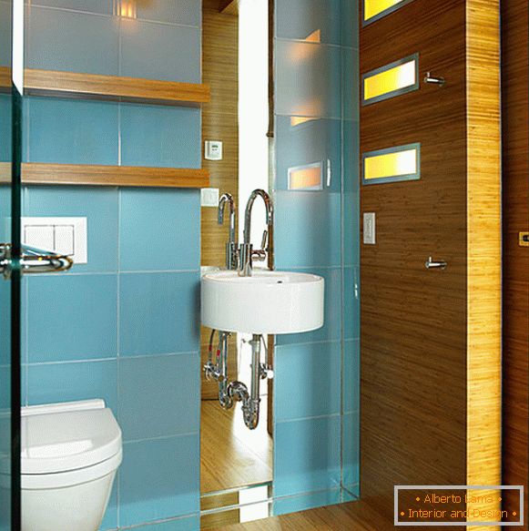 Blue wall tiles in a small bathroom