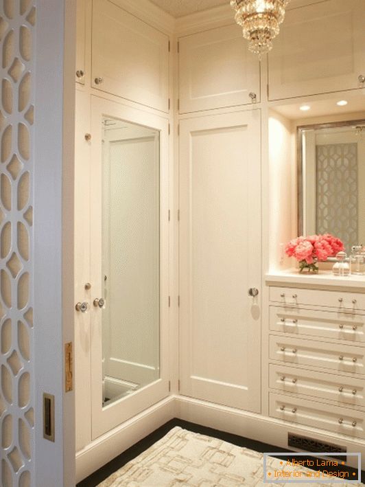 Stylish dressing room with white furniture