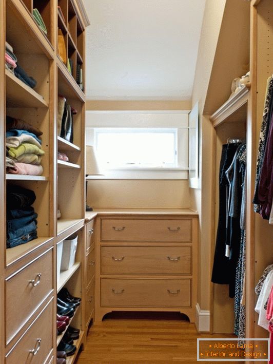 Small dressing room with wooden furniture