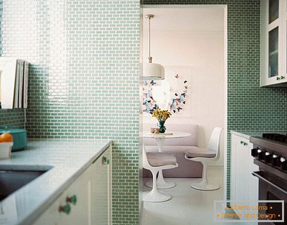 Small kitchen with soft green tiles