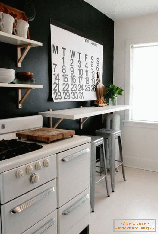 Black walls and white furniture in the kitchen