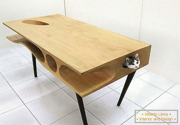 An unusual table with a house for a cat