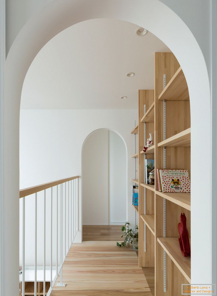 Arches on the second floor of a small house